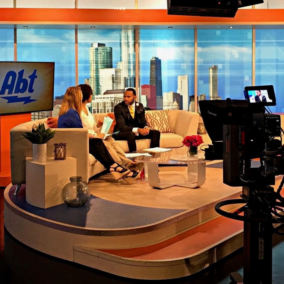 Samuel Sparks being interviewed on set at Abt