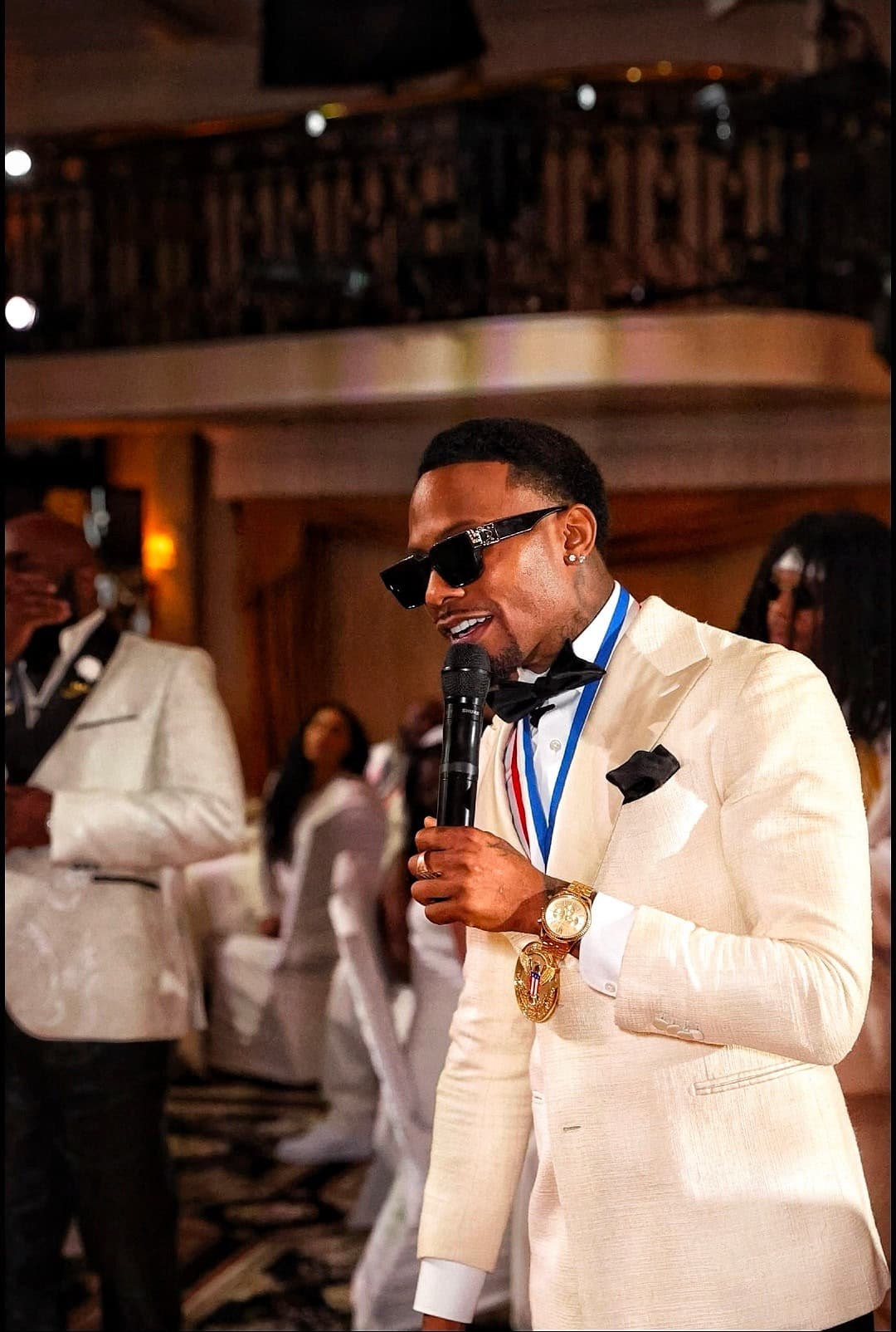 Samuel Sparks speaking at a gala